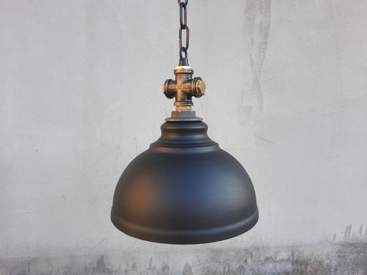 Suspended industrial black lampshade. Rustic kitchen chandelier for a country house.