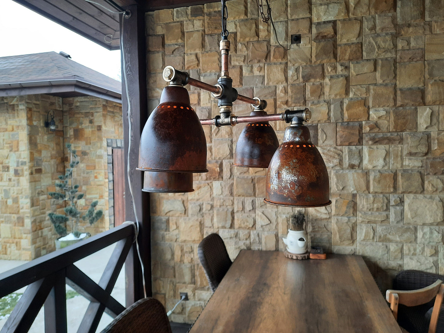Rusty industrial style ceiling chandelier. Hanging lamp, rustic hanging chandelier for country house.