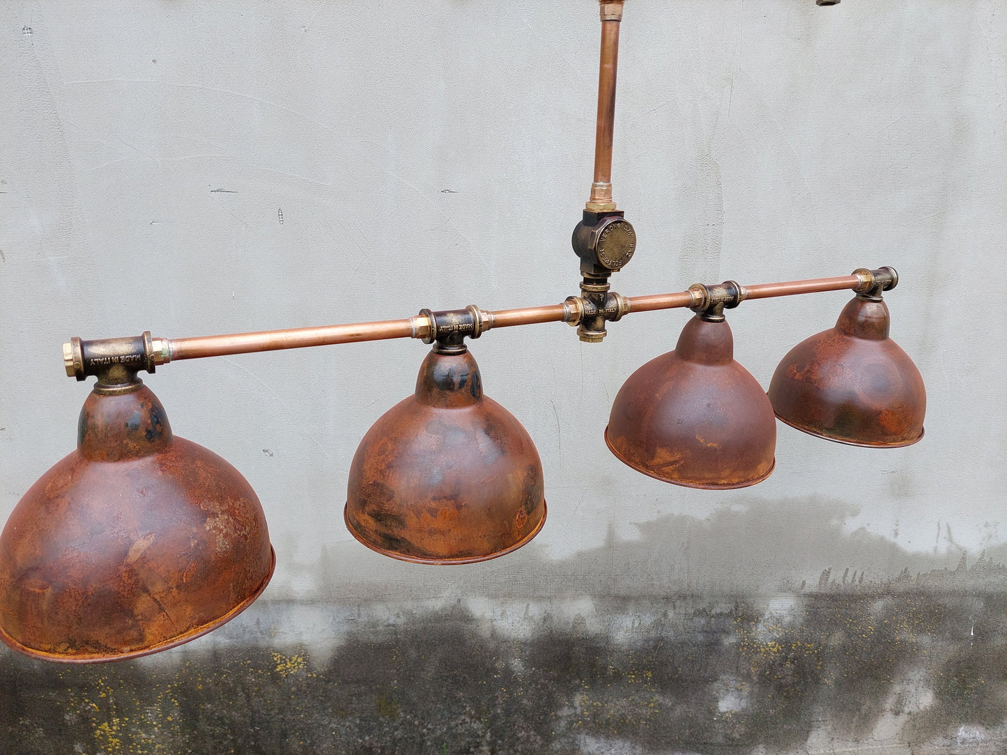 Industrial rustic pendant light for a kitchen island. Hanging rusty chandelier for a steampunk farmhouse.