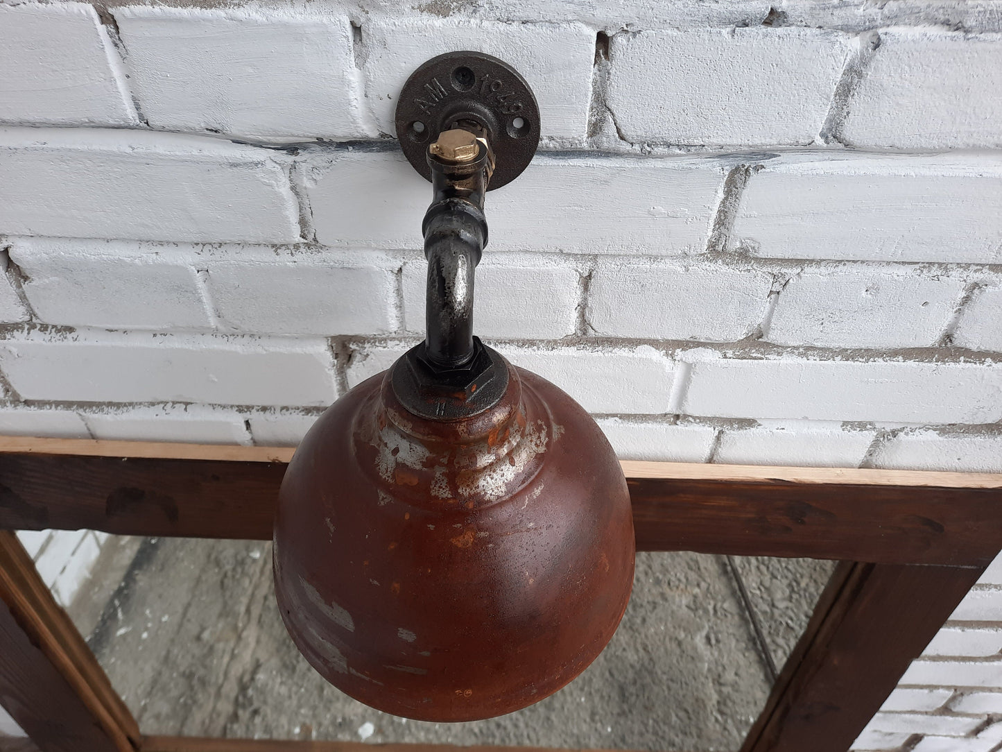 Rusty hanging wall lamp.Industrial wall light.