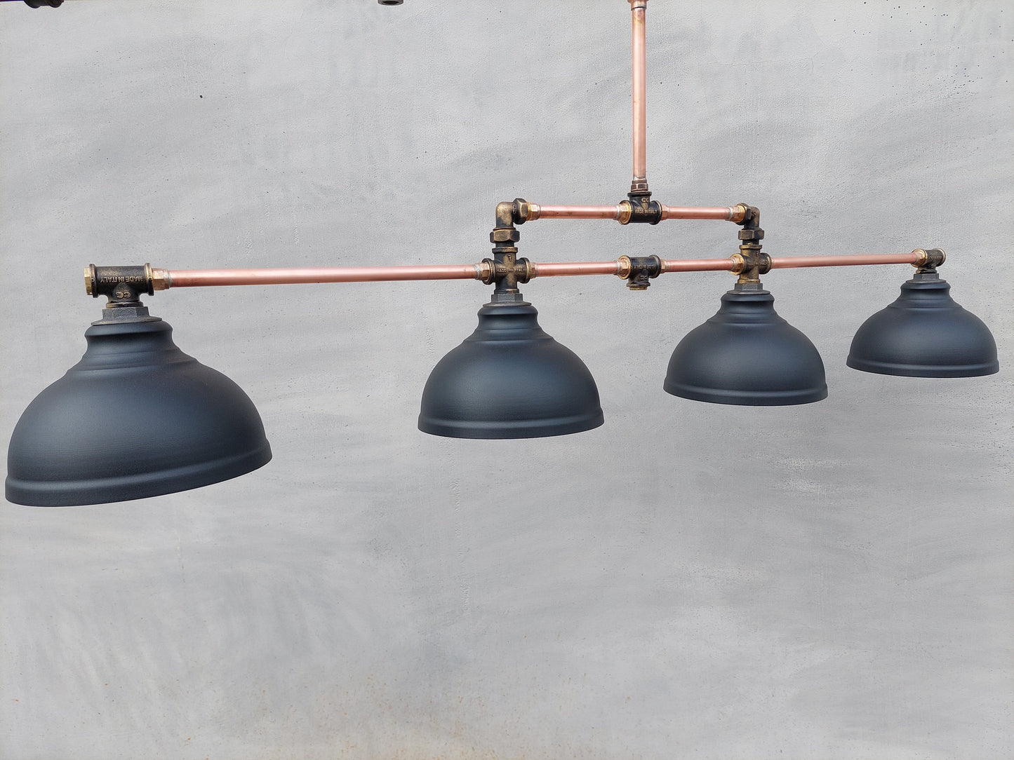 Industrial pendant lighting for the kitchen island. A long copper rustic chandelier for a billiard or dining table.