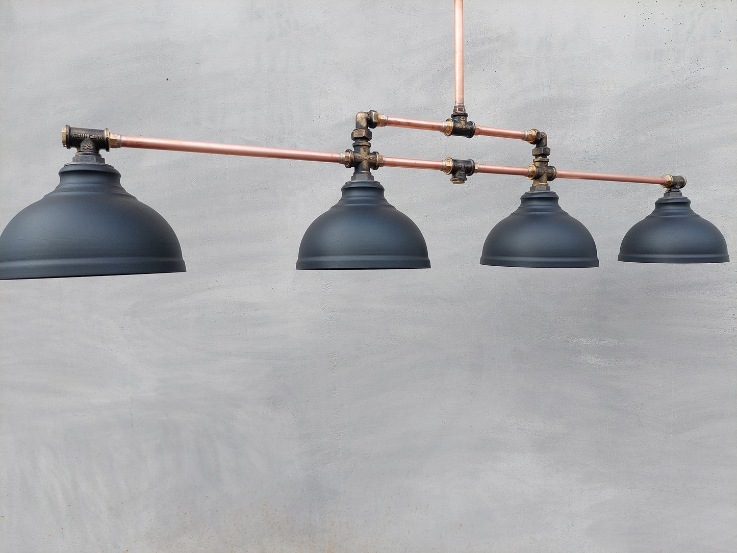 Industrial pendant lighting for the kitchen island. A long copper rustic chandelier for a billiard or dining table.