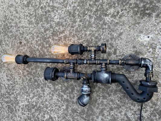 Vintage steampunk style wall light.Rustic industrial wall light.